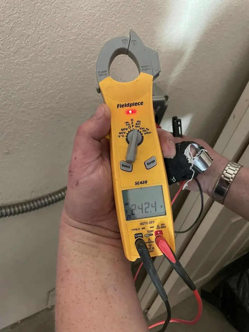 Voltage testing with clamp meter during Electrical Installation Services in Clarcona